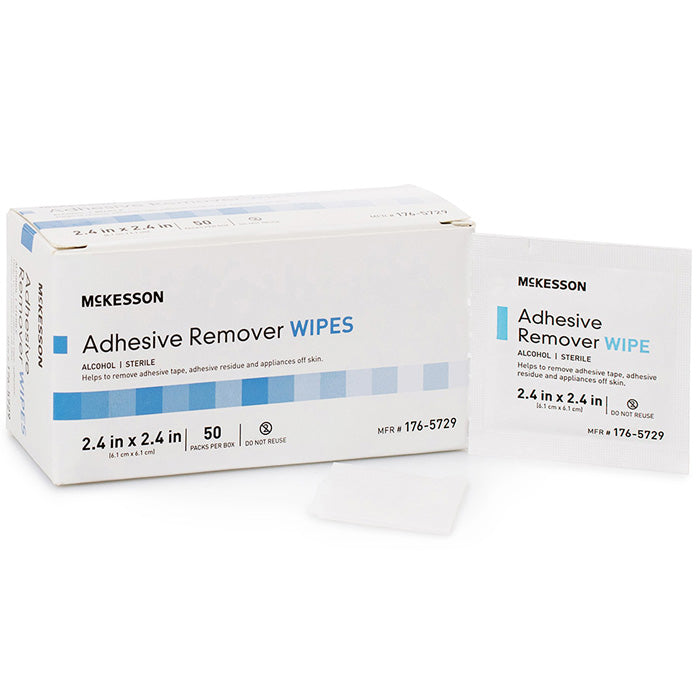 Adhesive Remover Wipes on a medical tray, used for safely removing tape and residue from skin after surgery or wound care.